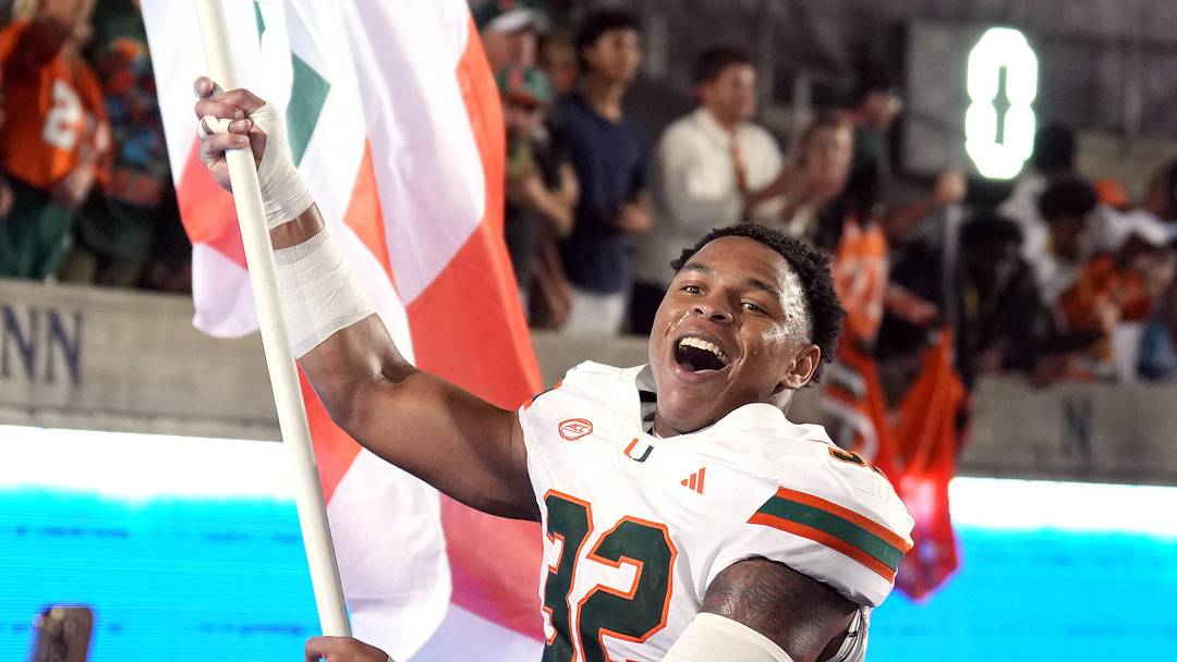 Oct 5, 2024; Berkeley, California, USA; Miami Hurricanes linebacker Raul Aguirre Jr. (32) carries a flag after defeating the California Golden Bears at California Memorial Stadium.