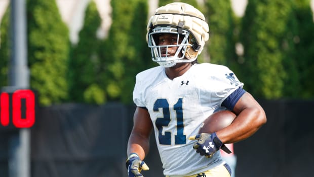 Running back Kedren Young gets a rep during Notre Dame's opening practice of the 2024 season.