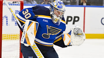 Apr 3, 2025; St. Louis, Missouri, USA;  St. Louis Blues goaltender Joel Hofer (30) defends the net against the Pittsburgh Penguins during the third period at Enterprise Center. Mandatory Credit: Jeff Curry-Imagn Images