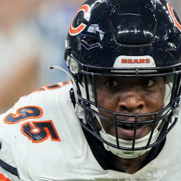 Chicago Bears defensive end DeMarcus Walker (95) moves in toward Indianapolis Colts running back Jonathan Taylor (28) on Sunday, Sept. 22, 2024, during a game against the Chicago Bears at Lucas Oil Stadium in Indianapolis.