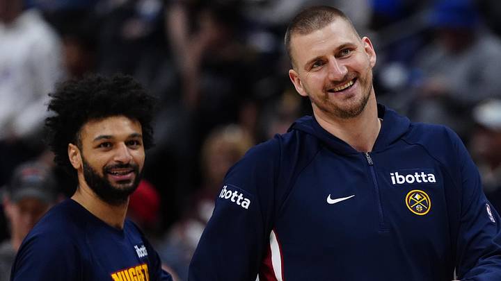 Mar 22, 2026; Denver, Colorado, USA; Denver Nuggets center Nikola Jokic (15) and guard Jamal Murray (27) react before the game against the Portland Trail Blazers at Ball Arena. Mandatory Credit: Ron Chenoy-Imagn Images