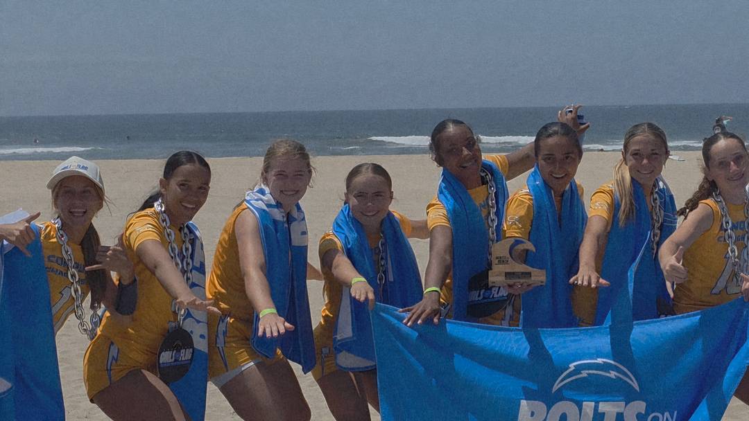 High School Champions LA Conquer pose by the ocean with trophy