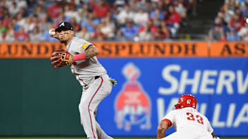 Aug 31, 2024; Philadelphia, Pennsylvania, USA; Atlanta Braves shortstop Orlando Arcia (11) gets force out on Philadelphia Phillies first base Bryce Harper (3) during the fifth inning at Citizens Bank Park. Mandatory Credit: Eric Hartline-Imagn Images