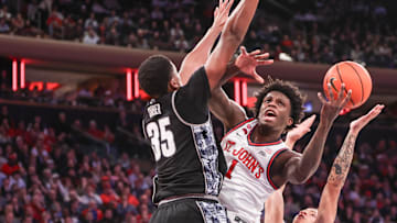 Jan 14, 2025; New York, New York, USA;  St. John's basketball guard Kadary Richmond (1) looks to drive past Georgetown Hoyas forward Thomas Sorber (35) in the second half at Madison Square Garden. 