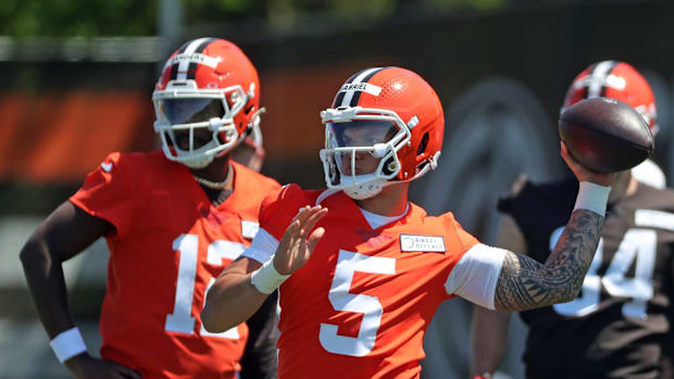 Cleveland Browns quarterback Dillon Gabriel (5) throws as quarterback Shedeur Sanders (12) looks on during NFL rookie minicam