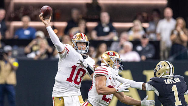 San Francisco 49ers quarterback Mac Jones throws a pass against the New Orleans Saints.