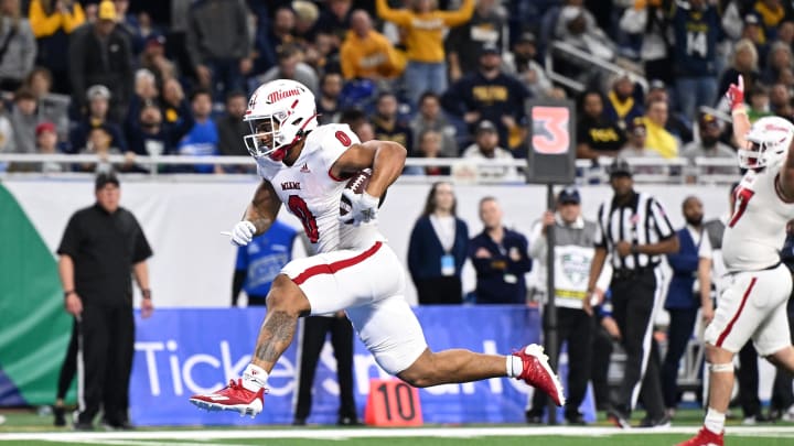 Dec 2, 2023; Detroit, MI, USA; Miami (OH) Redhawks running back Rashad Amos (0) runs for a touchdown against the Toledo Rockets in the fourth quarter at Ford Field. Mandatory Credit: Lon Horwedel-USA TODAY Sports
