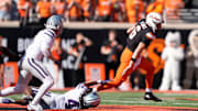 Oklahoma State's Zane Flores (6) gets by Kansas State's Daniel Cobbs (4) in the first half of the college football game between Oklahoma State University and the Kansas State Wildcats at Boone Pickens Stadium in Stillwater, Okla., Saturday Nov. 15, 2025.