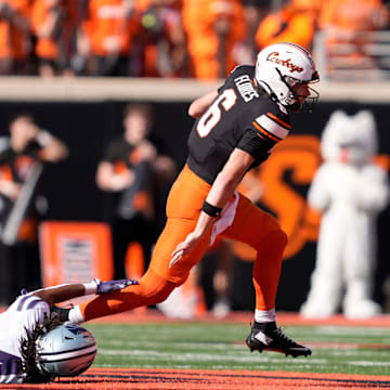 Oklahoma State's Zane Flores (6) gets by Kansas State's Daniel Cobbs (4) in the first half of the college football game between Oklahoma State University and the Kansas State Wildcats at Boone Pickens Stadium in Stillwater, Okla., Saturday Nov. 15, 2025.