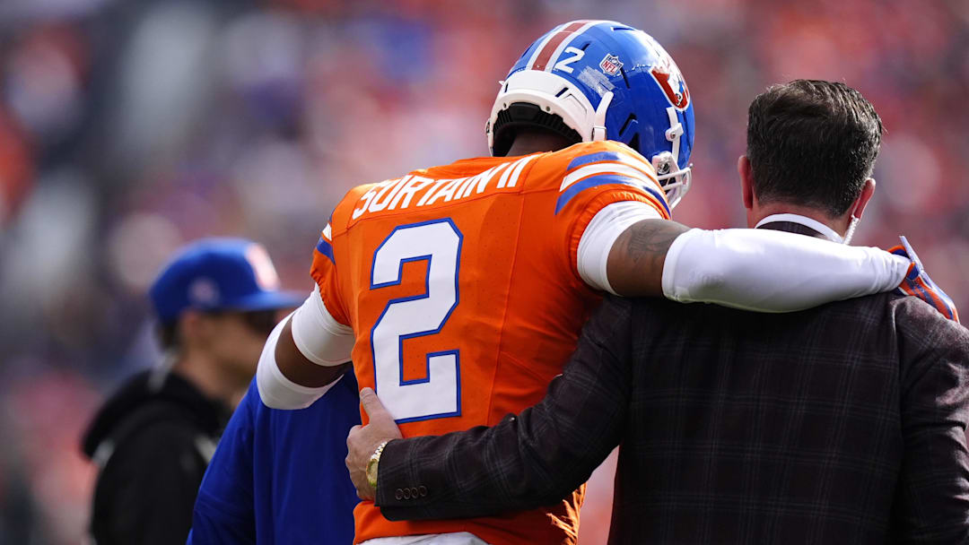 Oct 26, 2025; Denver, Colorado, USA; Denver Broncos cornerback Pat Surtain II (2) leaves the field after an injury in the first quarter against the Denver Broncos at Empower Field at Mile High.