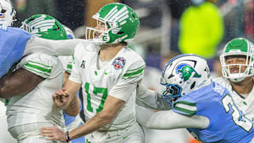 In the battle to meet Oregon in the playoffs the Tulane Green Wave played like they were enraged by winged helmets. They picked ff North Texas quarterback Drew Mestemaker three times and sacked him five, two by Santana Hopper.