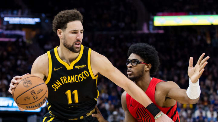 Dec 23, 2023; San Francisco, California, USA;  Portland Trail Blazers guard Scoot Henderson (00) defends Golden State Warriors forward Klay Thompson (11) during the second half at Chase Center. Mandatory Credit: John Hefti-USA TODAY Sports