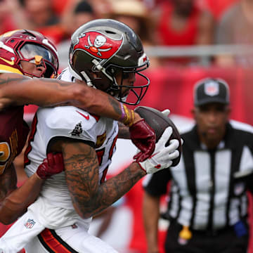 Sep 8, 2024; Tampa, Florida, USA; Tampa Bay Buccaneers wide receiver Mike Evans (13) catches a passs for a touchdown defended by Washington Commanders cornerback Benjamin St-Juste (25) in the second quarter at Raymond James Stadium. Mandatory Credit: Nathan Ray Seebeck-Imagn Images