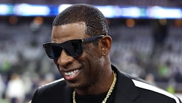 Nov 30, 2023; Arlington, Texas, USA; Colorado Buffaloes head coach Deion Sanders (right) talks with Dallas Cowboys owner Jerry Jones before the game against the Seattle Seahawks at AT&T Stadium. Mandatory Credit: Tim Heitman-Imagn Images