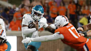 Aug 30, 2025; Charlottesville, Virginia, USA; Coastal Carolina Chanticleers quarterback MJ Morris (7) runs with the ball against the Virginia Cavaliers during the second half at Scott Stadium. Mandatory Credit: Amber Searls-Imagn Images