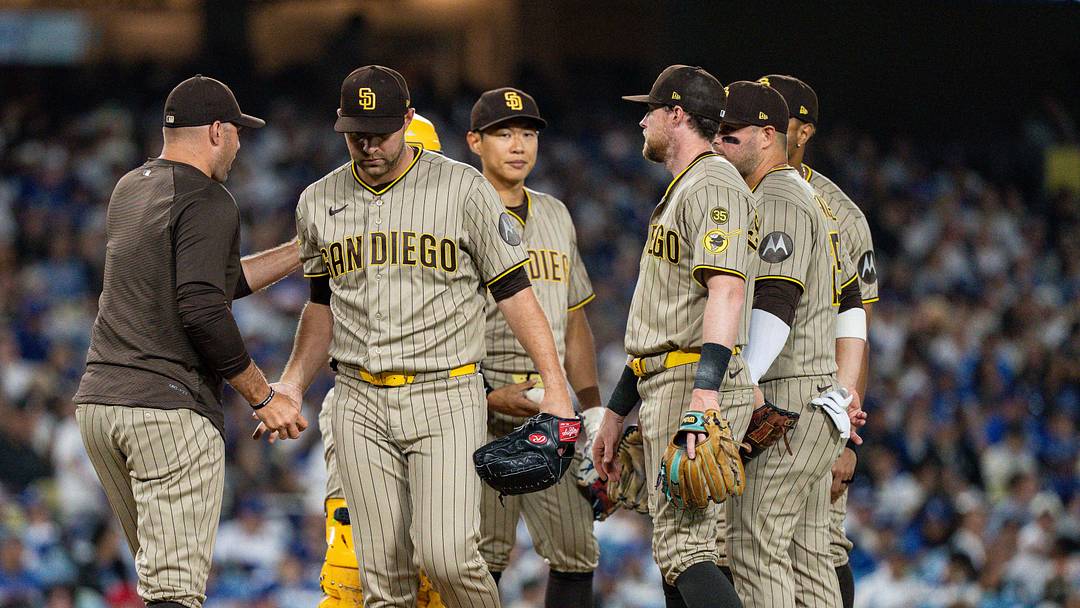 San Diego Padres manager Craig Stammen (14) takes the ball from pitcher Michael King (34) in the seventh inning against the Los Angeles Dodgers at Dodger Stadium on July 3, 2026.