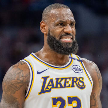Apr 27, 2025; Minneapolis, Minnesota, USA; Los Angeles Lakers forward LeBron James (23) talks with a referee in the third quarter against the Minnesota Timberwolves during game four of first round for the 2025 NBA Playoffs at Target Center. Mandatory Credit: Matt Blewett-Imagn Images