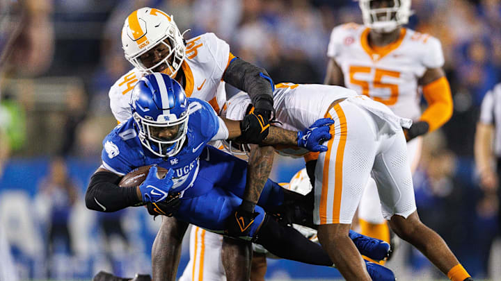 Oct 28, 2023; Lexington, Kentucky, USA; Kentucky Wildcats running back Demie Sumo-Karngbaye (0) is tackled during the fourth quarter against the Tennessee Volunteers at Kroger Field. Mandatory Credit: Jordan Prather-Imagn Images