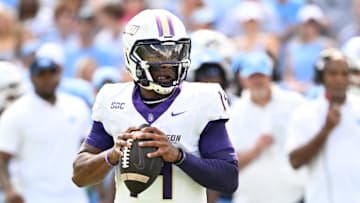 Sep 21, 2024; Chapel Hill, North Carolina, USA; James Madison Dukes quarterback Alonza Barnett III (14) looks to pass in the second quarter at Kenan Memorial Stadium. Mandatory Credit: Bob Donnan-Imagn Images