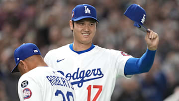  Los Angeles Dodgers designated hitter Shohei Ohtani gestures before the game against the Hanshin Tigers at Tokyo Dome. 
