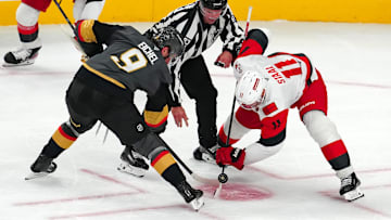 Oct 20, 2025; Las Vegas, Nevada, USA; Vegas Golden Knights center Jack Eichel (9) takes a face off against Carolina Hurricanes center Jordan Staal (11) during the third period at T-Mobile Arena. Mandatory Credit: Stephen R. Sylvanie-Imagn Images
