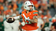 Oct 17, 2025; Miami Gardens, Florida, USA; Miami Hurricanes quarterback Carson Beck (11) throws the football against the Louisville Cardinals during the first quarter at Hard Rock Stadium. Mandatory Credit: Sam Navarro-Imagn Images