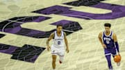 Brendan Wenzel bringing the ball down the court against Kansas