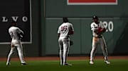 Boston Red Sox center fielder Ceddanne Rafaela left fielder Jarren Duran and right fielder Wilyer Abreu react after defeating the Cincinnati Reds at Fenway Park. 