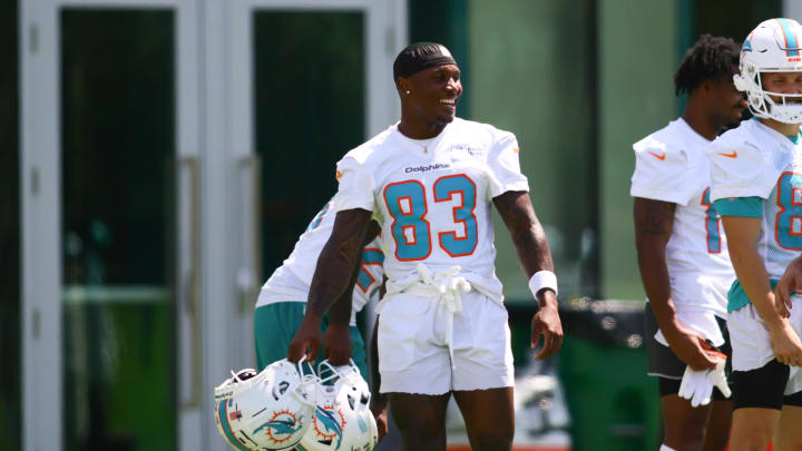 Jun 5, 2024; Miami Gardens, FL, USA; Miami Dolphins wide receiver Malik Washington (83) reacts during mandatory minicamp at Baptist Health Training Complex. Mandatory Credit: Sam Navarro-USA TODAY Sports.