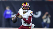 Sep 23, 2024; Cincinnati, Ohio, USA; Washington Commanders quarterback Jayden Daniels (5) runs during the fourth quarter against the Cincinnati Bengals at Paycor Stadium. Mandatory Credit: Joseph Maiorana-Imagn Images