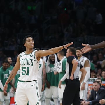 Oct 13, 2019; Boston, MA, USA; Seven-foot five-inch Boston Celtics center Tacko Fall (99) reaches out to touch hands with 5'10\" guard Tremont Waters (51) during the second half of a preseason game against the Cleveland Cavaliers at TD Garden. Mandatory Credit: Winslow Townson-Imagn Images