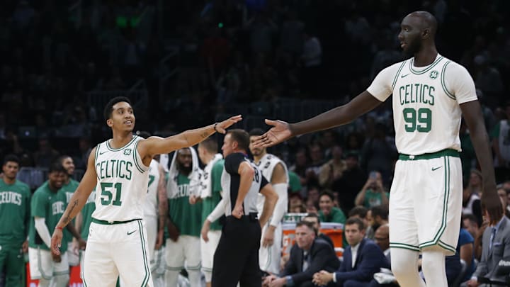 Oct 13, 2019; Boston, MA, USA; Seven-foot five-inch Boston Celtics center Tacko Fall (99) reaches out to touch hands with 5'10\" guard Tremont Waters (51) during the second half of a preseason game against the Cleveland Cavaliers at TD Garden. Mandatory Credit: Winslow Townson-Imagn Images