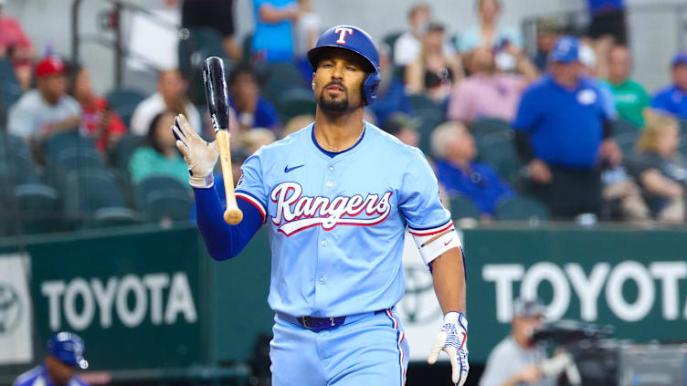  Texas Rangers second baseman Marcus Semien (2) reacts