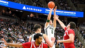 Dec 7, 2024; East Lansing, Michigan, USA;  Michigan State Spartans forward Frankie Fidler (8) puts in a jump shot over the Nebraska Cornhuskers defense during the second half at Jack Breslin Student Events Center. Mandatory Credit: Dale Young-Imagn Images