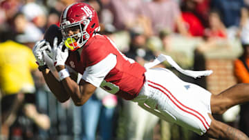 Nov 16, 2024; Tuscaloosa, Alabama, USA; Alabama Crimson Tide wide receiver Caleb Odom (18) dives in an attempt to complete a pass against the Mercer Bears during the first quarter at Bryant-Denny Stadium. Mandatory Credit: Will McLelland-Imagn Images