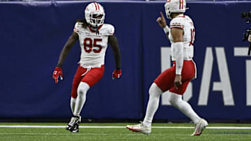 Jun 8, 2025; St. Louis, MO, USA; DC Defenders wide receiver Seth Williams (85) reacts with quarterback Jordan Ta'amu (10) after scoring a touchdown against the St. Louis Battlehawks at The Dome at America’s Center. Mandatory Credit: Jeff Le-Imagn Images