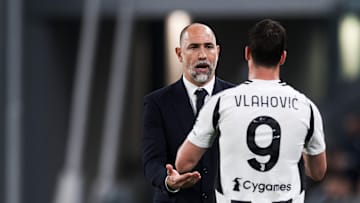 Igor Tudor (L), head coach of Juventus FC, high fives Dusan Vlahovic