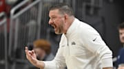 Mississippi Rebels head coach Chris Beard calls out instructions during the second half against the Louisville Cardinals at KFC Yum! Center.