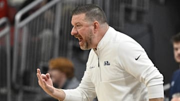 Mississippi Rebels head coach Chris Beard calls out instructions during the second half against the Louisville Cardinals at KFC Yum! Center.