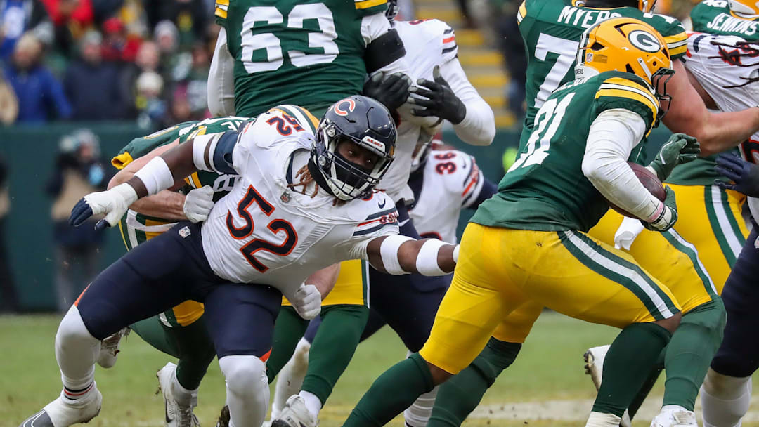 Chicago Bears defensive end Darrell Taylor (52) reaches for Green Bay Packers running back Emanuel Wilson (31) on Sunday, January 5, 2025, at Lambeau Field in Green Bay, Wis. 
Tork Mason/USA TODAY NETWORK-Wisconsin