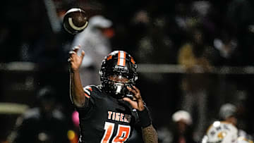 Belleville quarterback Bryce Underwood makes a pass against Saline during the first half of a district final playoff game at Belleville High School in Belleville on Friday, Nov. 8, 2024.