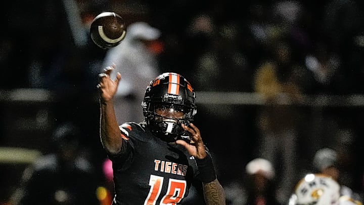 Belleville quarterback Bryce Underwood makes a pass against Saline during the first half of a district final playoff game at Belleville High School in Belleville on Friday, Nov. 8, 2024.