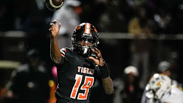 Belleville quarterback Bryce Underwood makes a pass against Saline during the first half of a district final playoff game at Belleville High School in Belleville on Friday, Nov. 8, 2024.