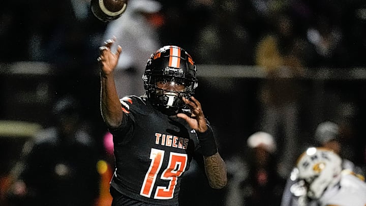 Belleville quarterback Bryce Underwood makes a pass against Saline during the first half of a district final playoff game at Belleville High School in Belleville on Friday, Nov. 8, 2024.