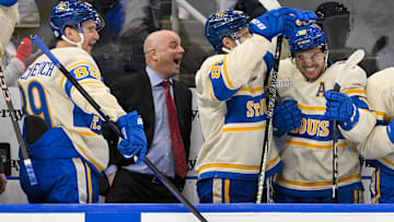 Feb 8, 2025; St. Louis, Missouri, USA;  St. Louis Blues left wing Pavel Buchnevich (89) head coach Jim Montgomery center Dylan Holloway (81) and center Robert Thomas (18) react after center Radek Faksa (not pictured) scored the game winning goal in the 10th round of shootouts against the Chicago Blackhawks at Enterprise Center. Mandatory Credit: Jeff Curry-Imagn Images
