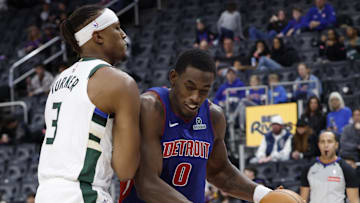 Dec 6, 2025; Detroit, Michigan, USA;  Detroit Pistons center Jalen Duren (0) dribbles defended by Milwaukee Bucks center Myles Turner (3) in the second half at Little Caesars Arena. Mandatory Credit: Rick Osentoski-Imagn Images
