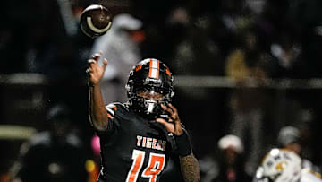 Belleville quarterback Bryce Underwood makes a pass against Saline during the first half of a district final playoff game at Belleville High School in Belleville on Friday, Nov. 8, 2024.