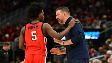 Mar 23, 2025; Milwaukee, WI, USA;  Mississippi Rebels head coach Chris Beard talks with Mississippi Rebels guard Jaylen Murray (5) during the first half in the second round of the NCAA Tournament against the Iowa State Cyclones at Fiserv Forum. Mandatory Credit: Benny Sieu-Imagn Images