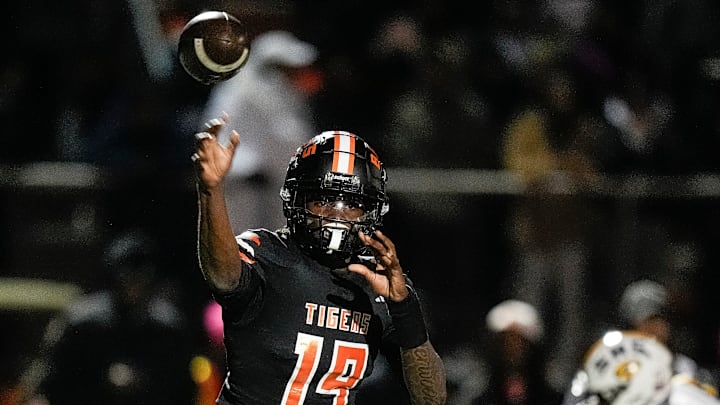Belleville quarterback Bryce Underwood makes a pass against Saline during the first half of a district final playoff game at Belleville High School in Belleville on Friday, Nov. 8, 2024.