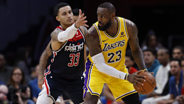 Los Angeles Lakers forward LeBron James (23) holds the ball as Washington Wizards forward Kyle Kuzma (33) defends in the second half at Capital One Arena.
